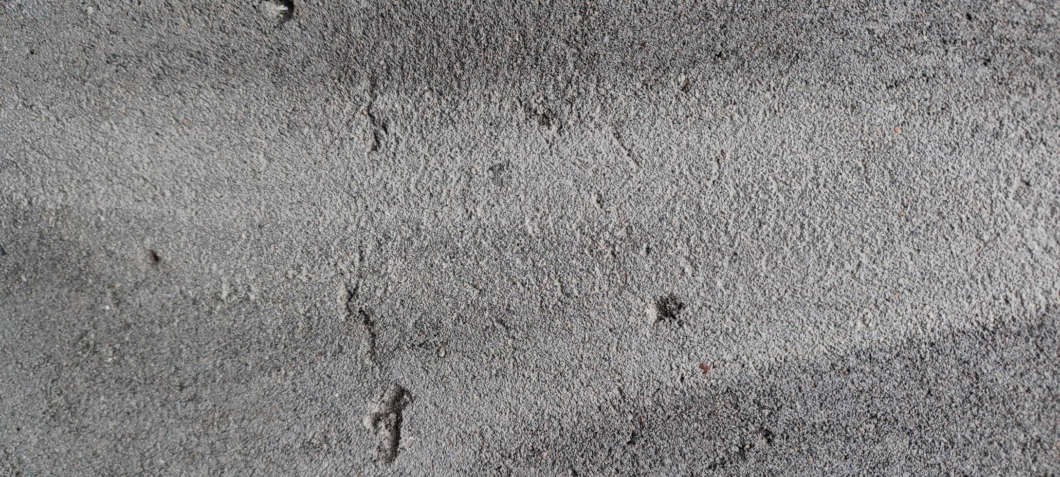 a close up of a concrete wall with some paint photo