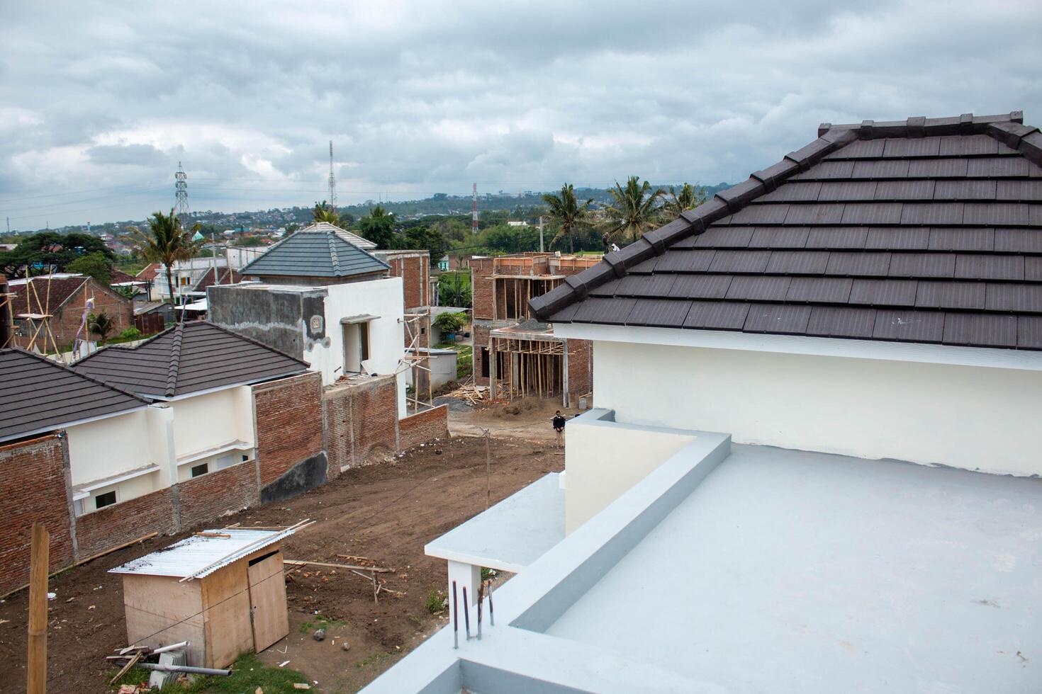 A cloudy sky above from building house photo