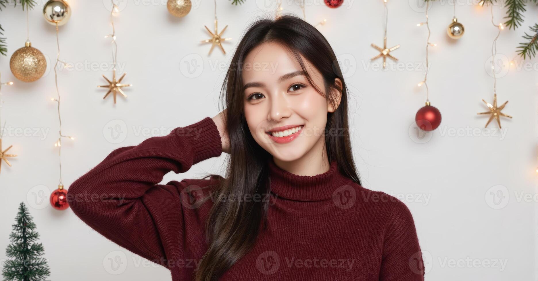 Festive portrait of lady in red knitwear posing before decorated evergreen tree photo