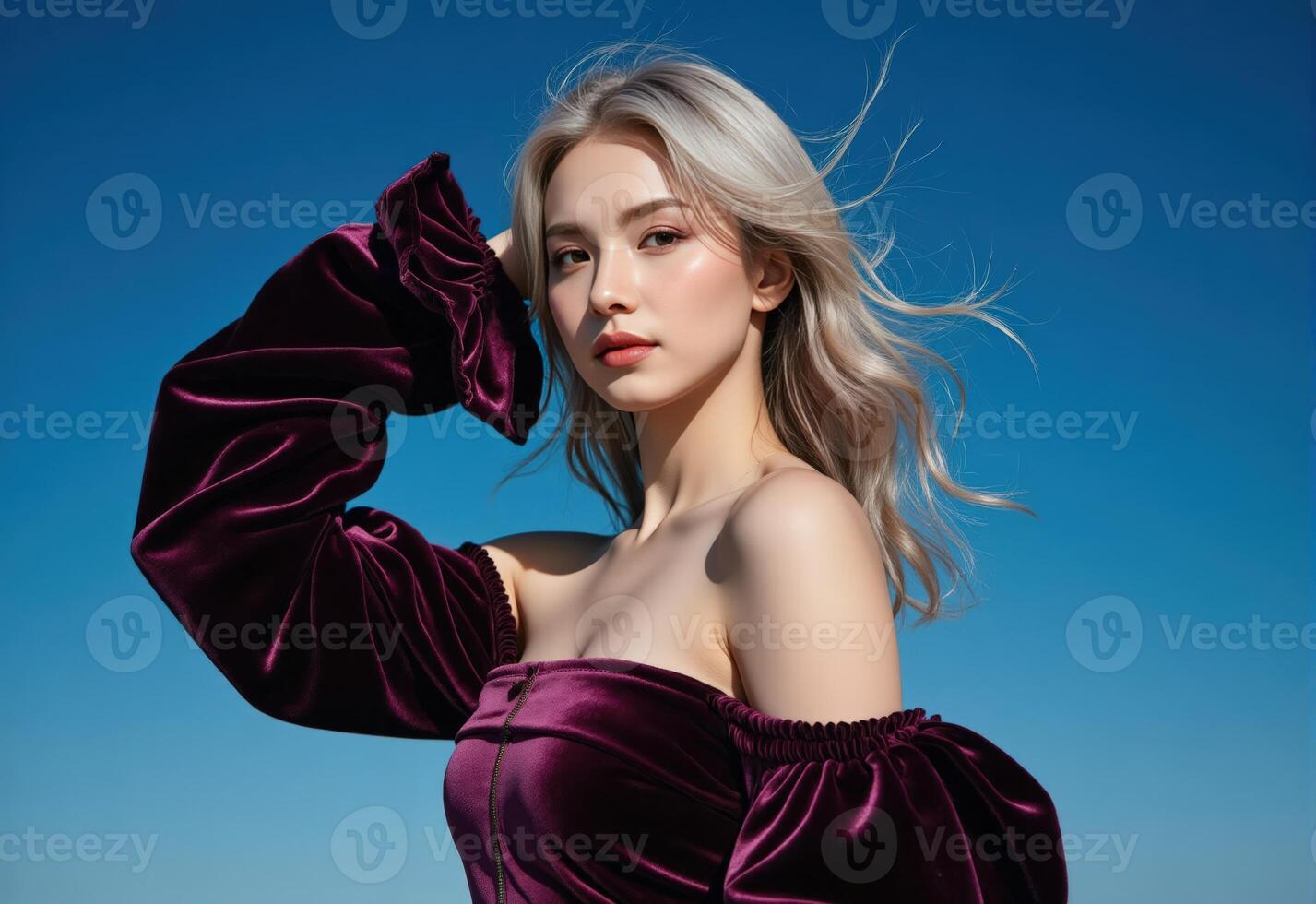 A woman in a purple velvet dress is posing photo