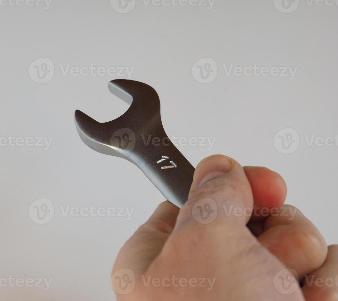 hand holds wrench spanner size 17 mm photo