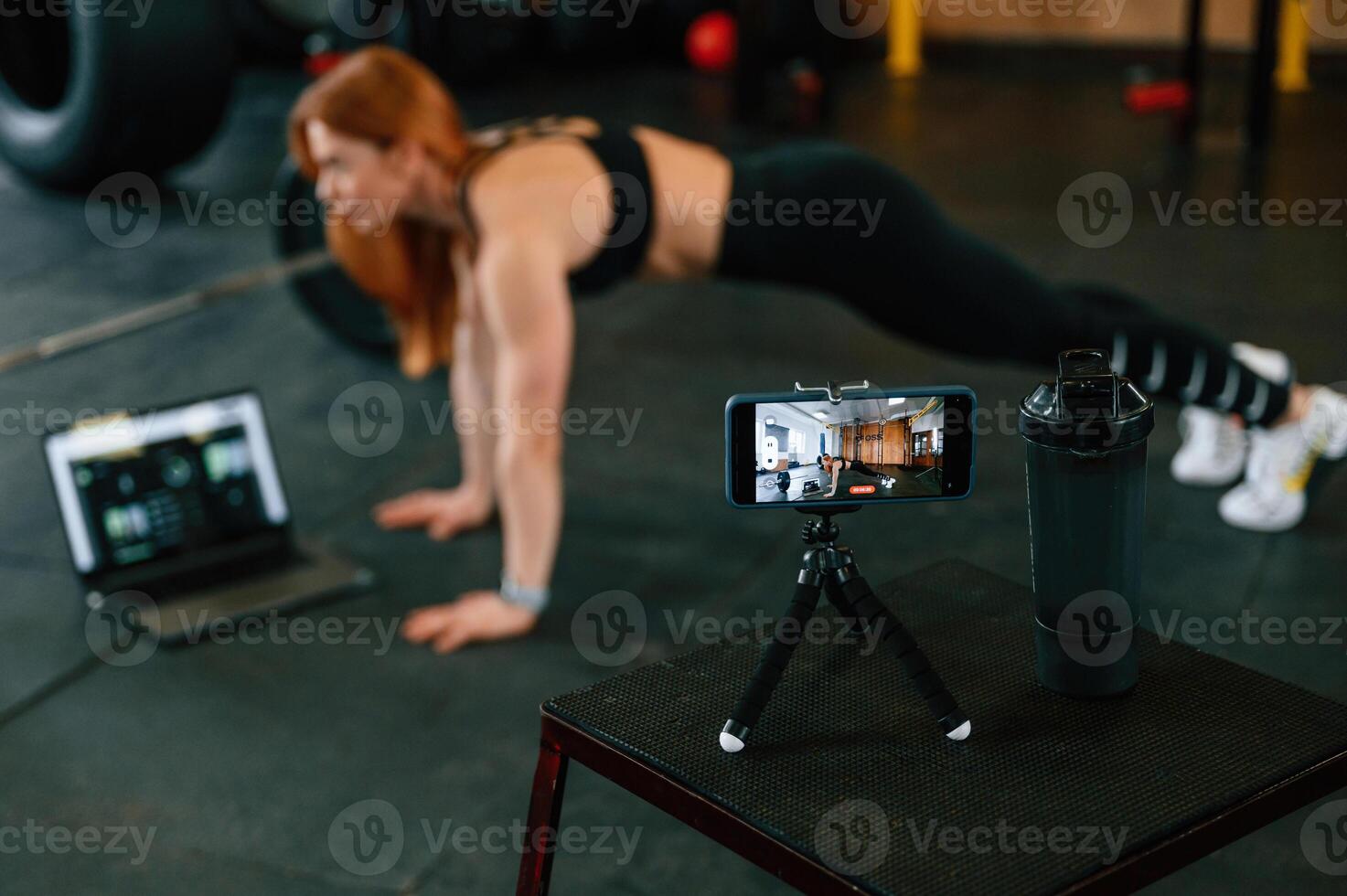 Beautiful strong woman is in the gym photo