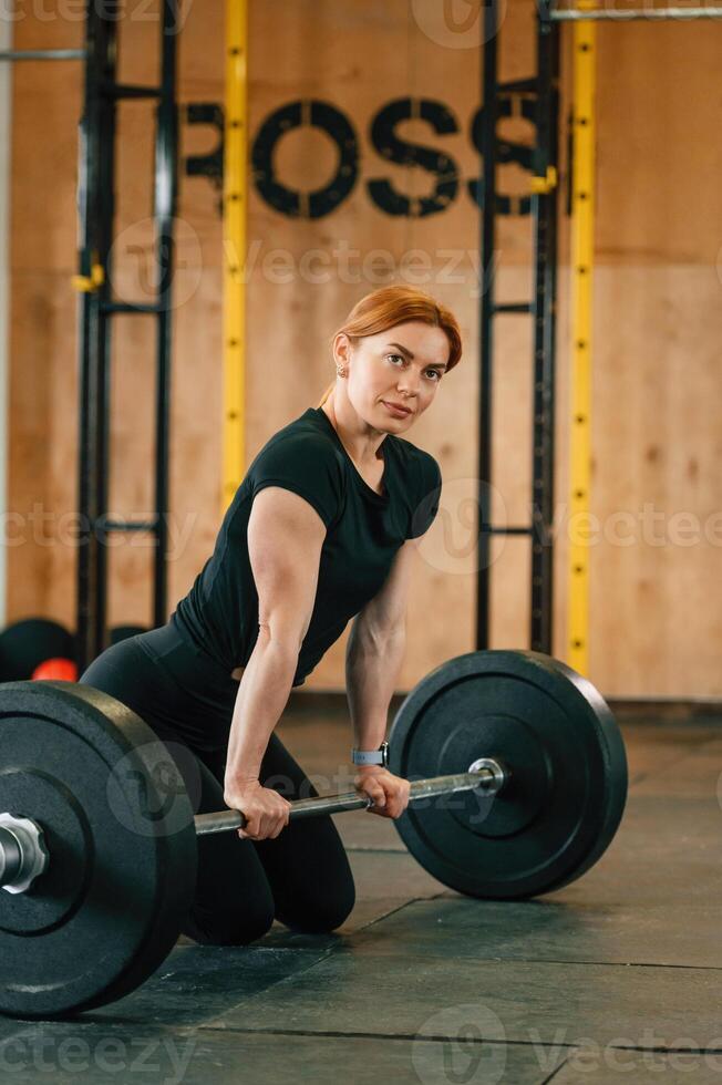 Beautiful strong woman is in the gym., photo