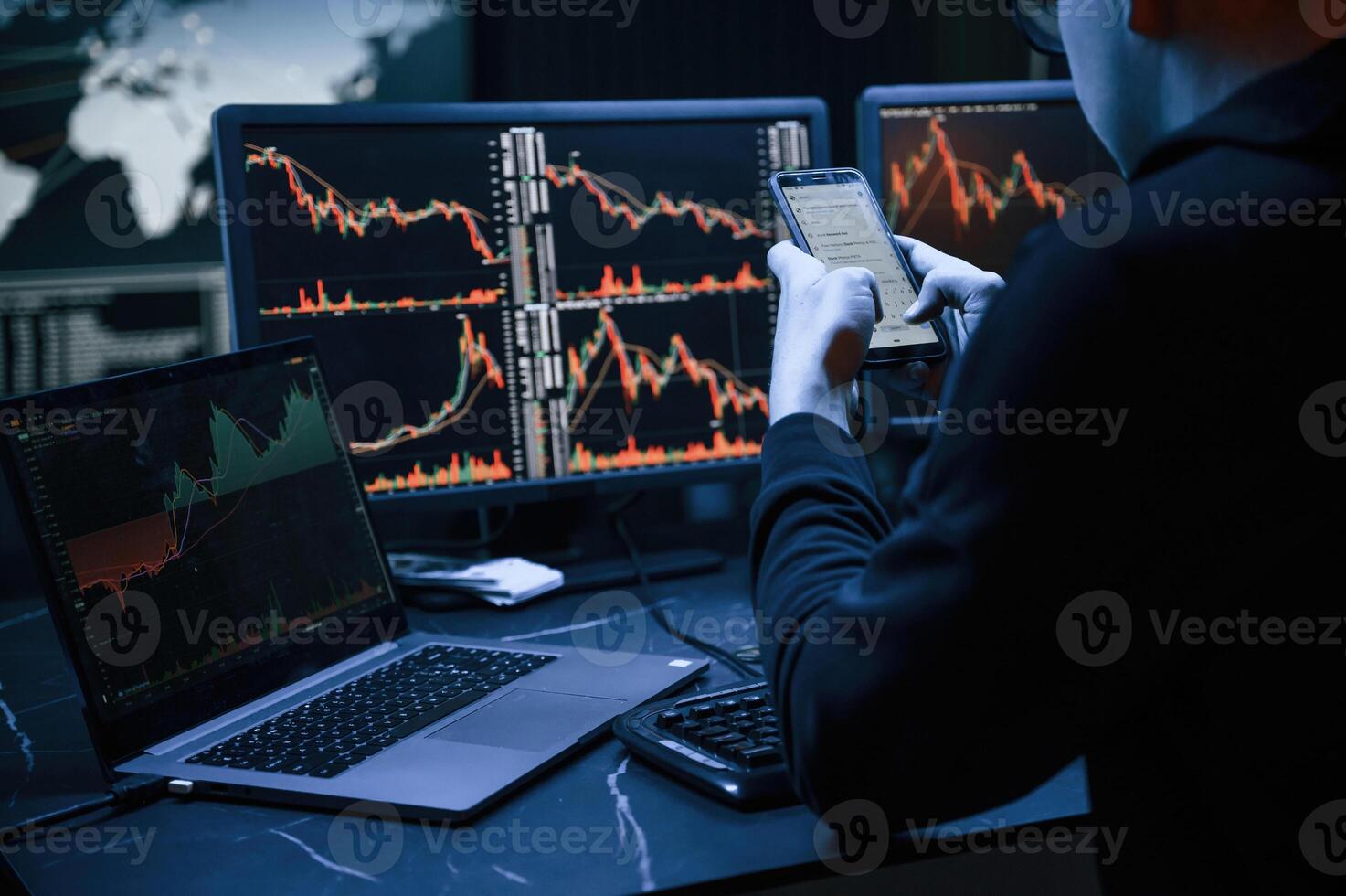 Financial Analyst Working, on a Computer with Multi-Monitor Workstation with Real-Time Stocks, Commodities and Exchange Market Charts. photo
