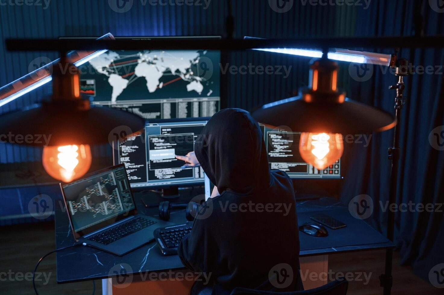 Information, on, screens. Young professional female hacker is indoors by computer with lot of information on displays photo