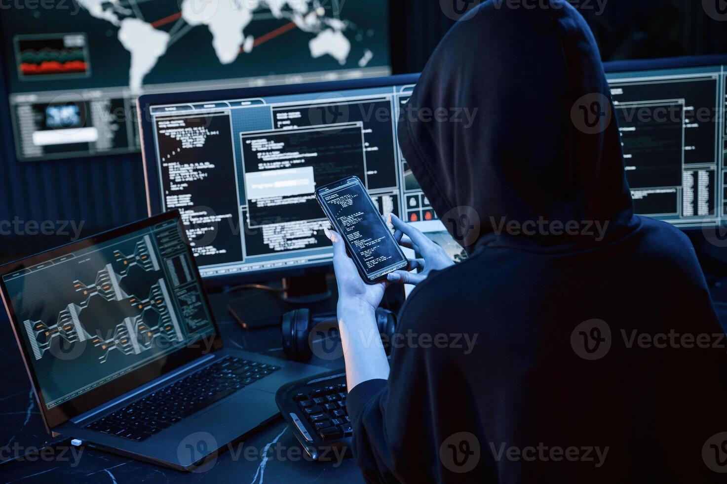 Modern ,technology. Young professional female hacker is indoors by computer with lot of information on displays photo