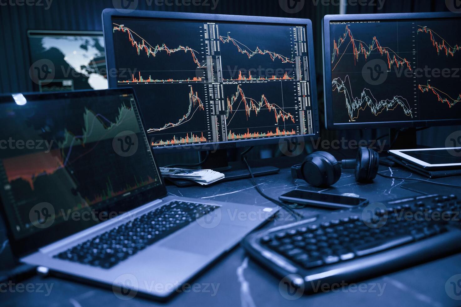 Financial Analyst Working on a Computer with, Multi-Monitor Workstation with Real-Time Stocks, Commodities and Exchange Market Charts. photo
