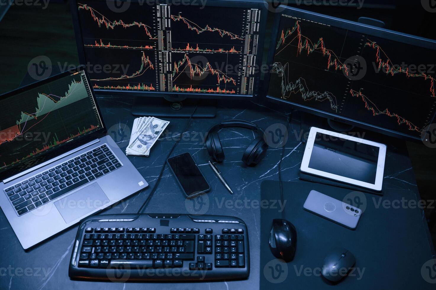 Financial ,Analyst Working on a Computer ,with, Multi-Monitor Workstation with Real-Time Stocks, Commodities and Exchange Market Charts. photo