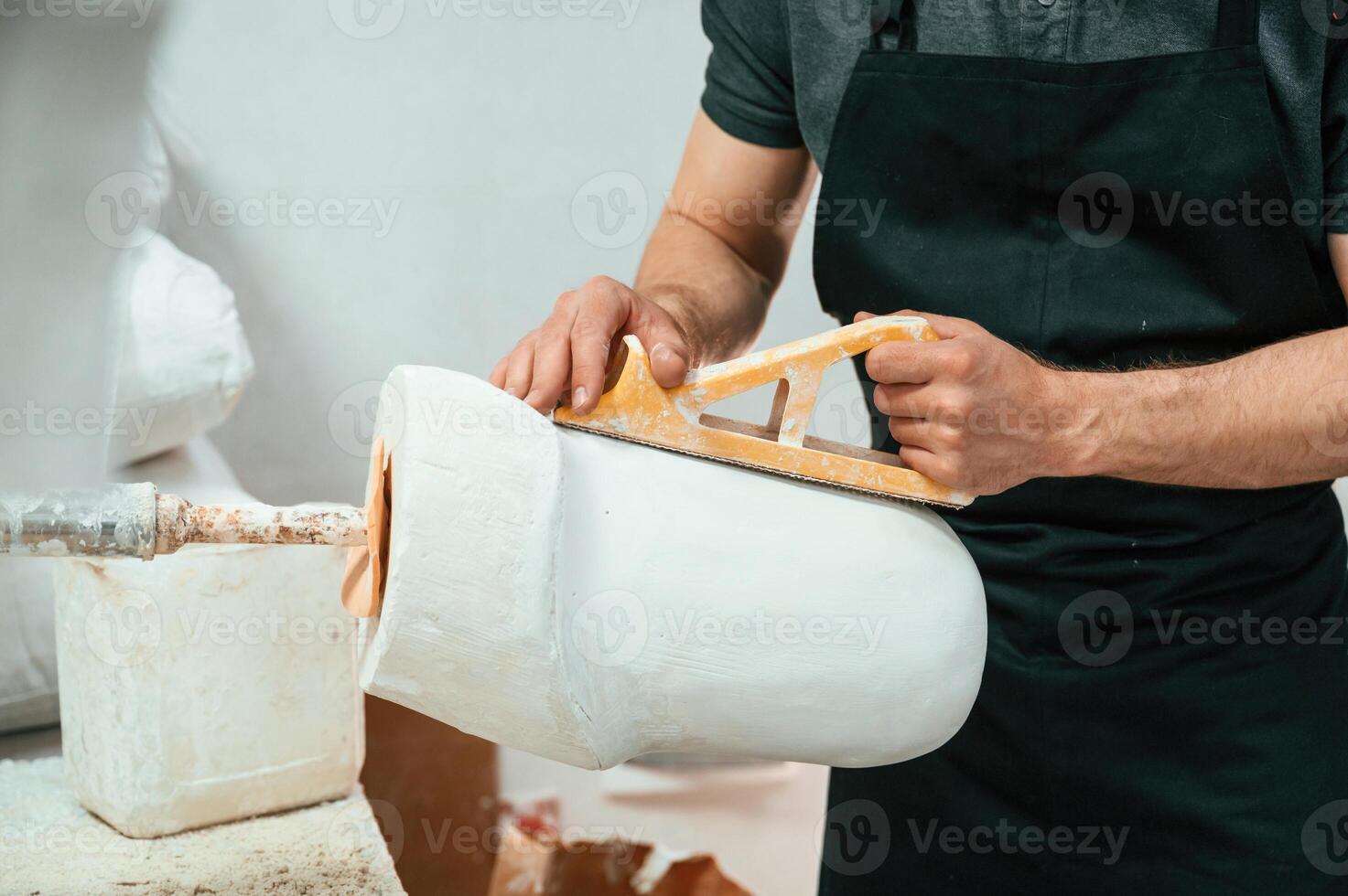 Raw ,product for prosthesis.. Technician working in modern laboratory photo