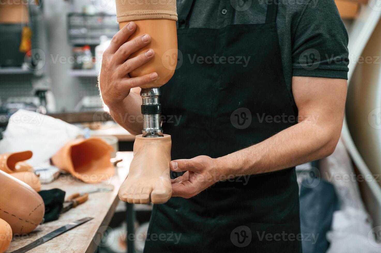 Close up view... Technician holding prosthesis in hands photo