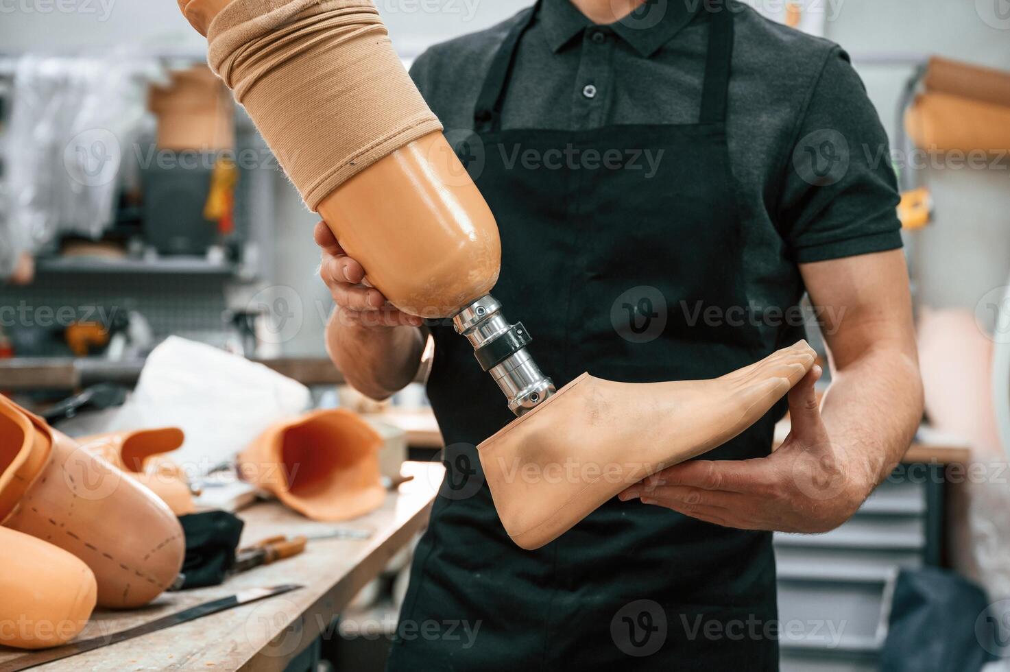 Close up view.,, Technician holding prosthesis in hands photo
