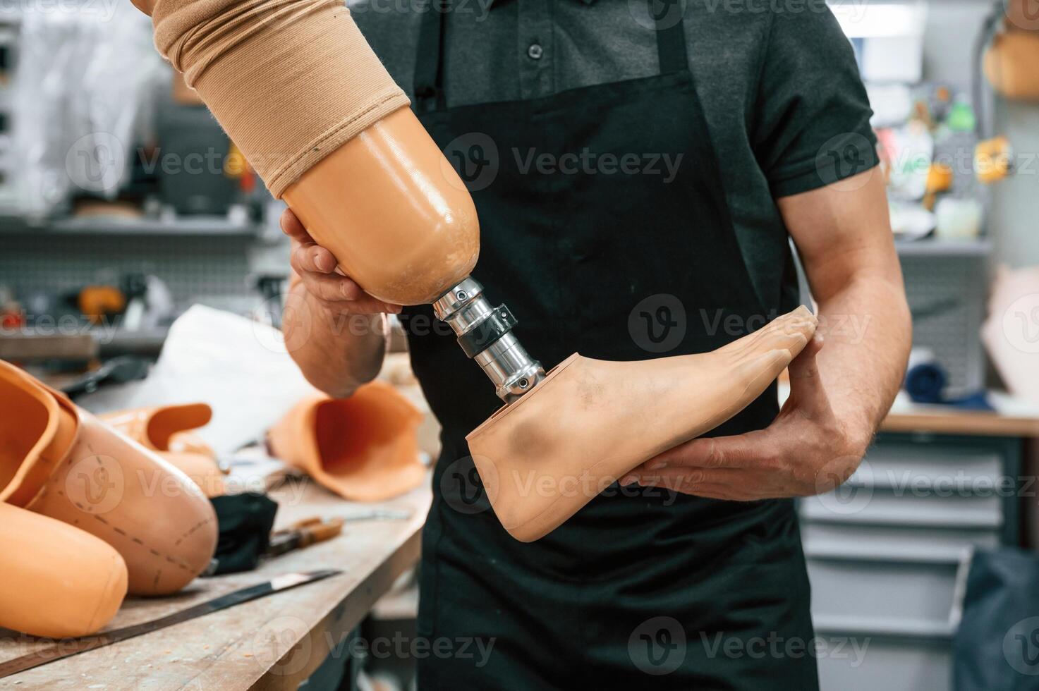 Close up ,view. Technician ,holding prosthesis in hands photo