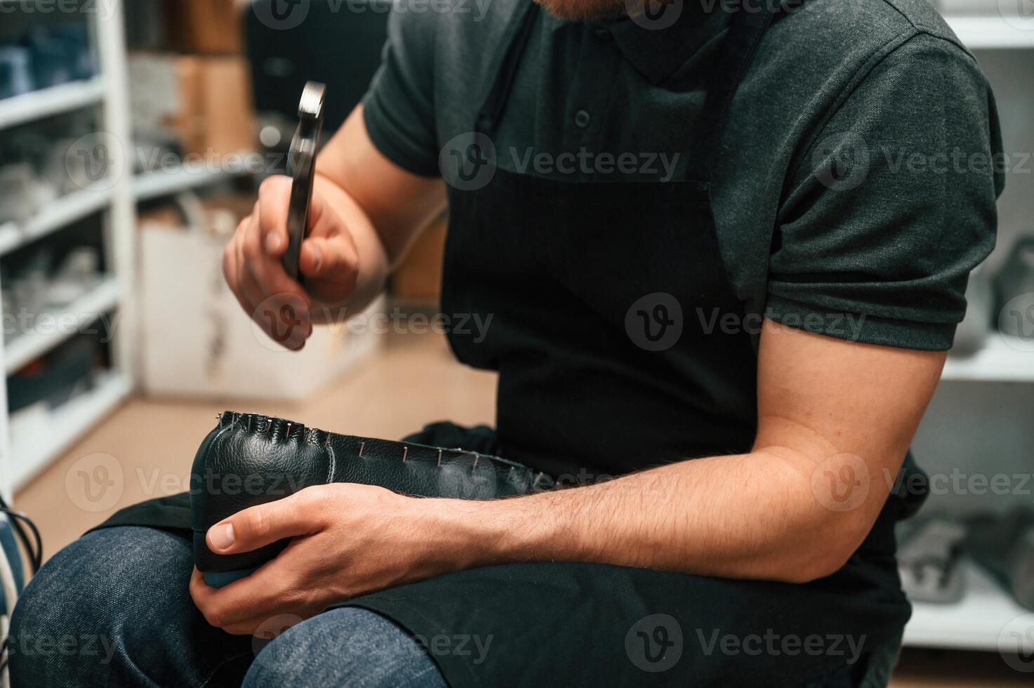 With shoe for prosthesis. ,Technician working in modern laboratory photo