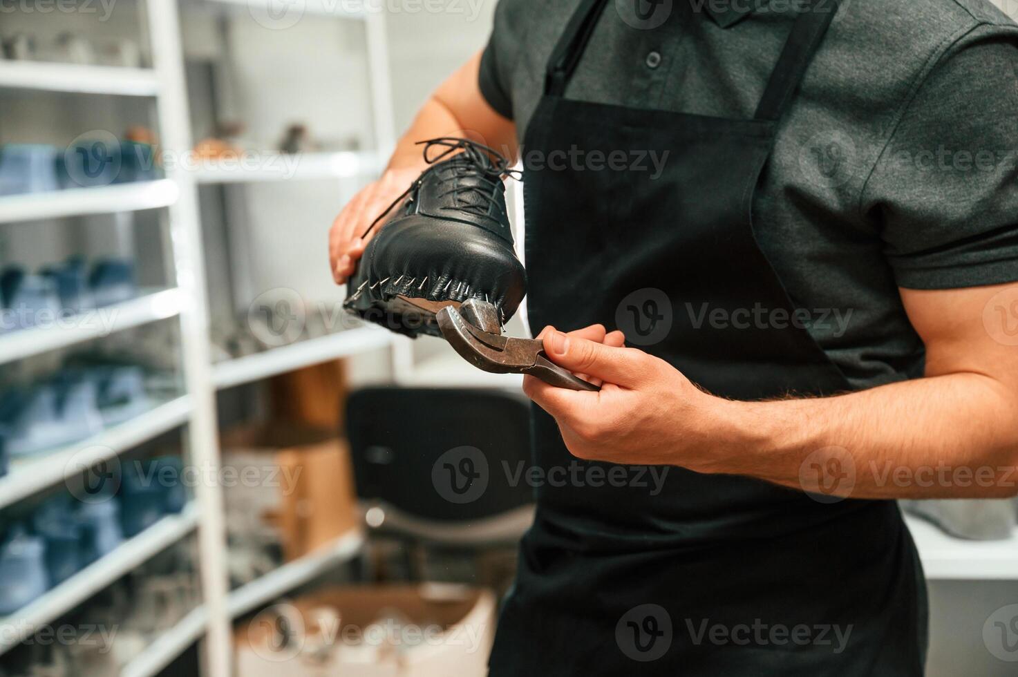 With, shoe for prosthesis. Technician working in modern laboratory photo