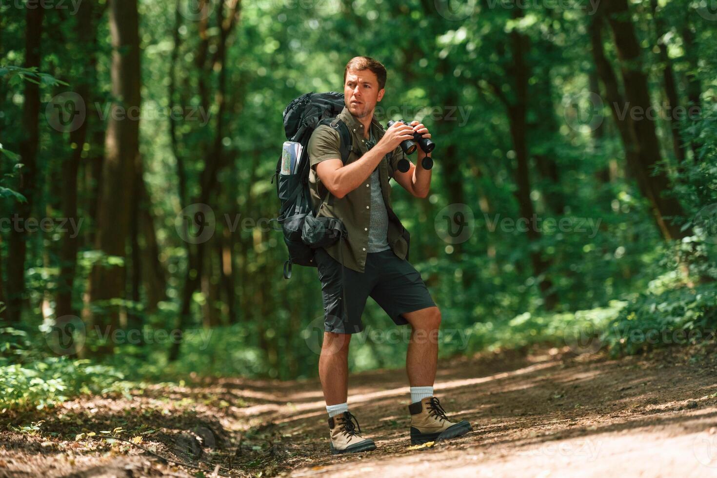 Tourist, in ,summer forest. Conception of exploration and leisure photo