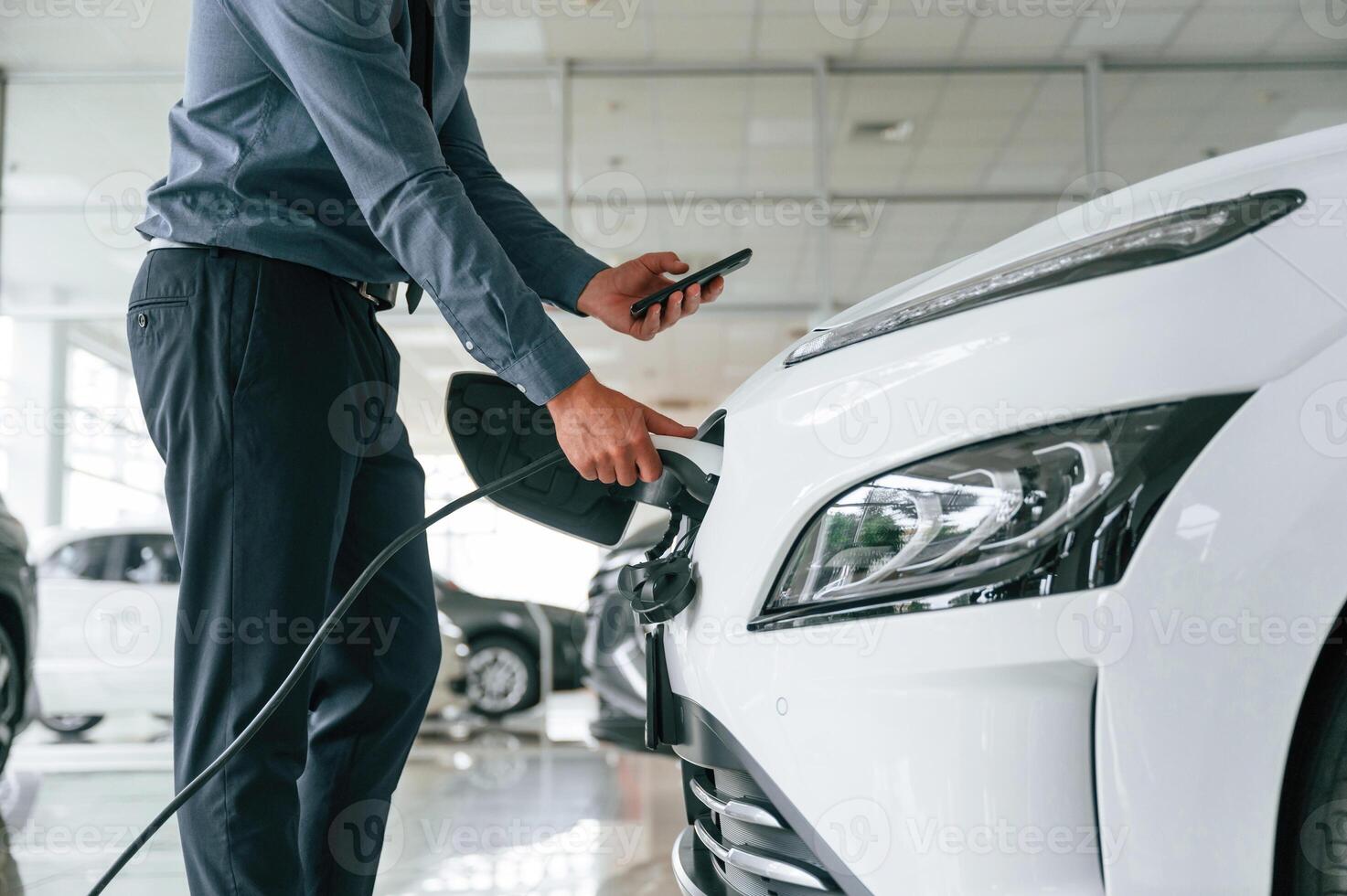 Close up view of man, that, is with electrical car photo