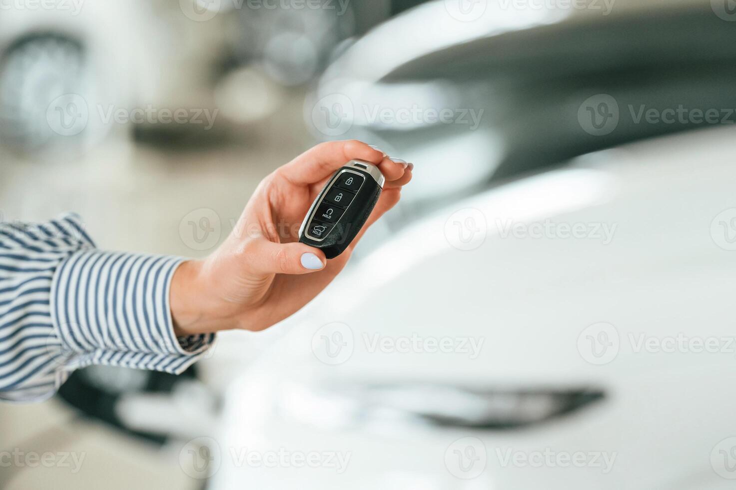 Close, up view of woman, that is with electric car photo