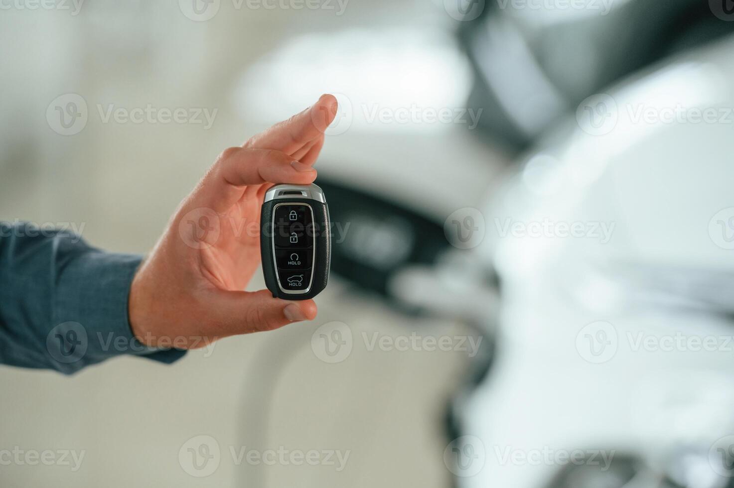 Close up view of man that is with electrical car photo