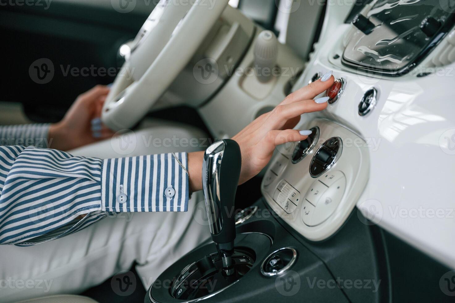 Front ,panel of automobile, driving. Close up view of woman that is with electric car photo