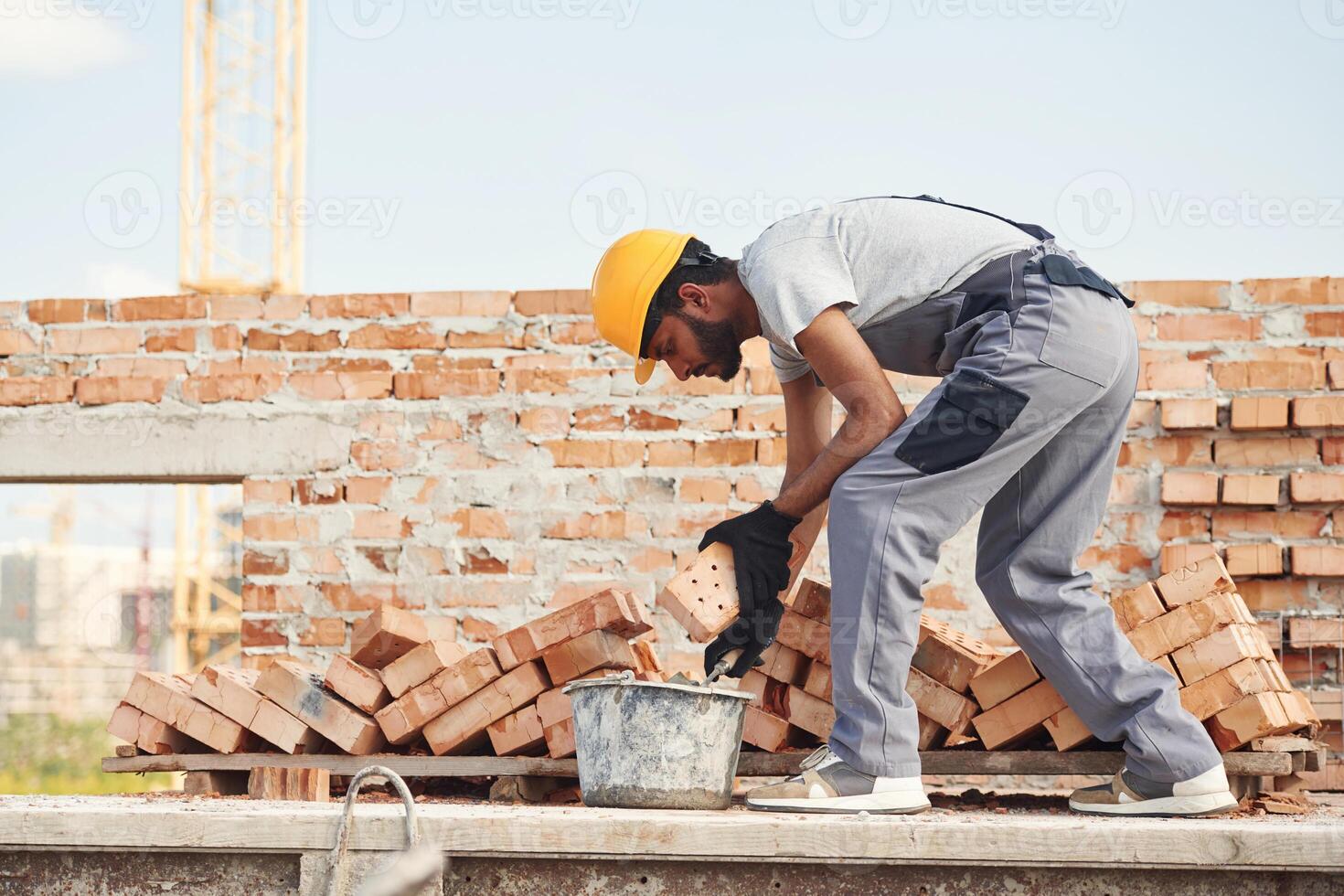 Focused, on ,work. Handsome Indian man is on the construction site photo