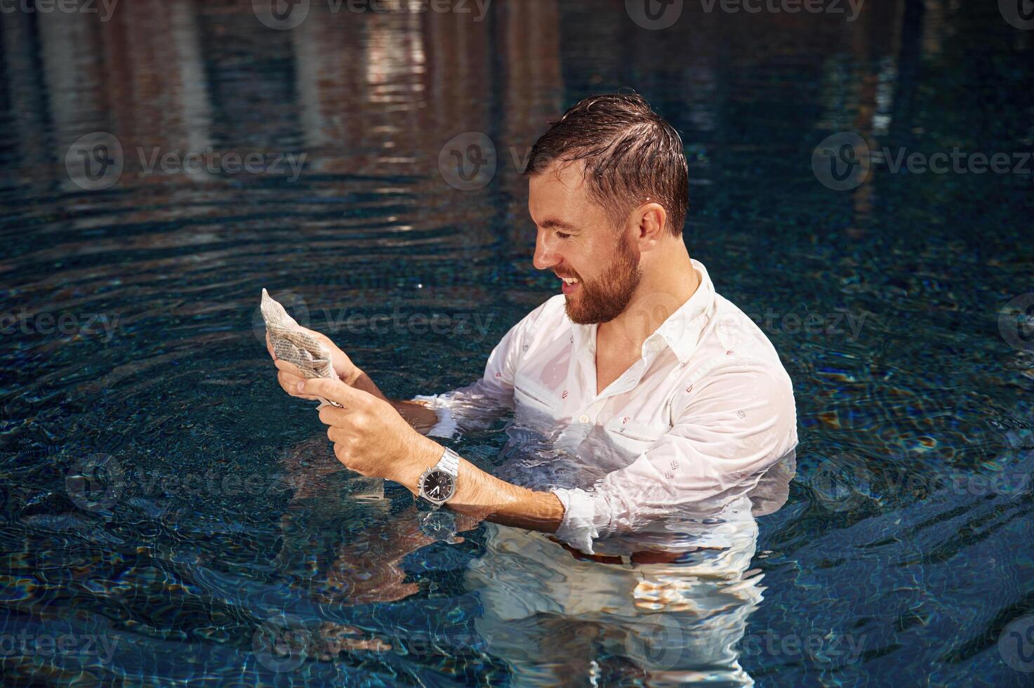 Handsome man, in formal clothes is in the pool photo