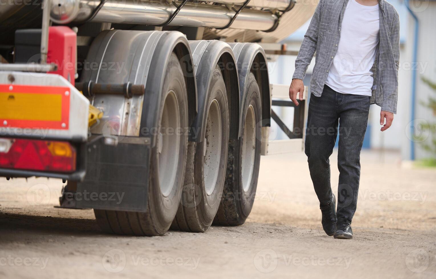 Young truck driver in casual clothes photo