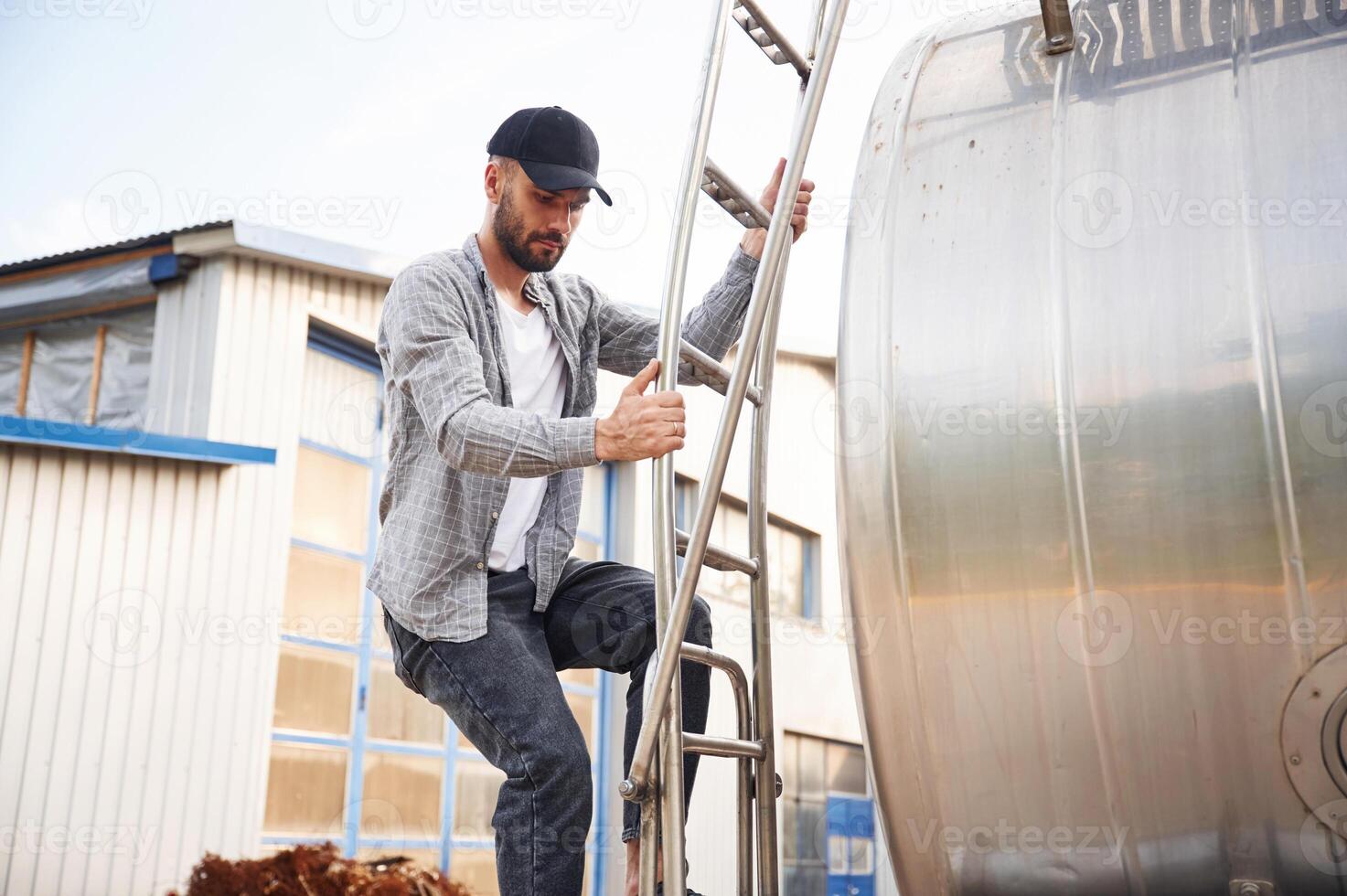 Quality control., Young truck driver in casual clothes photo
