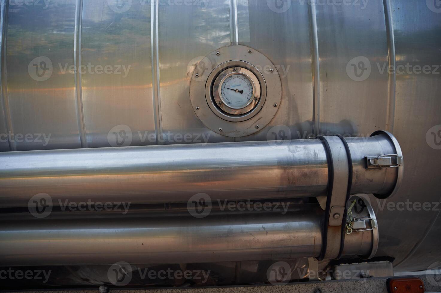 Close up view of fuel tanker with temperature check device photo