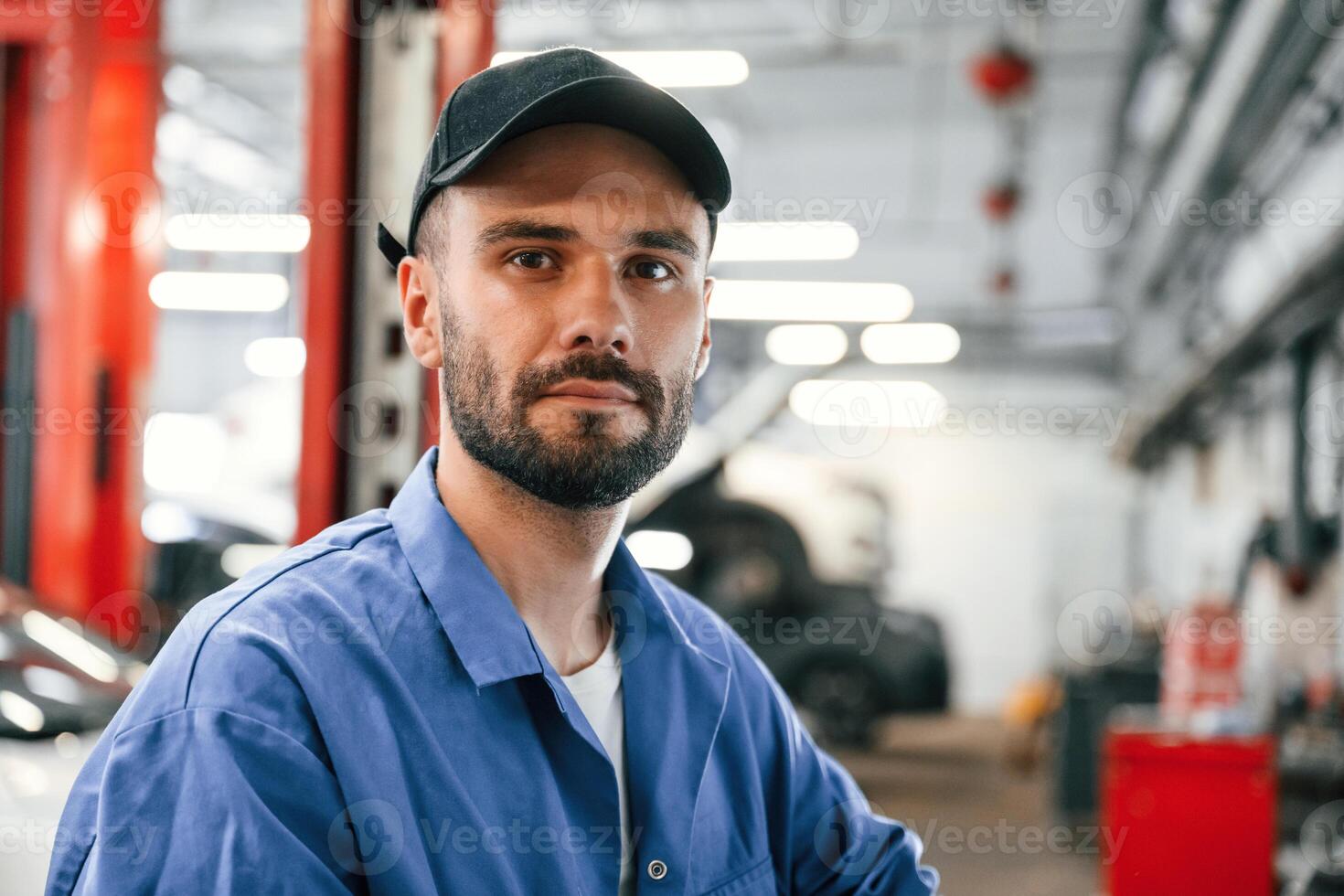 Portrait ,of, auto mechanic that is in garage. Repair service photo