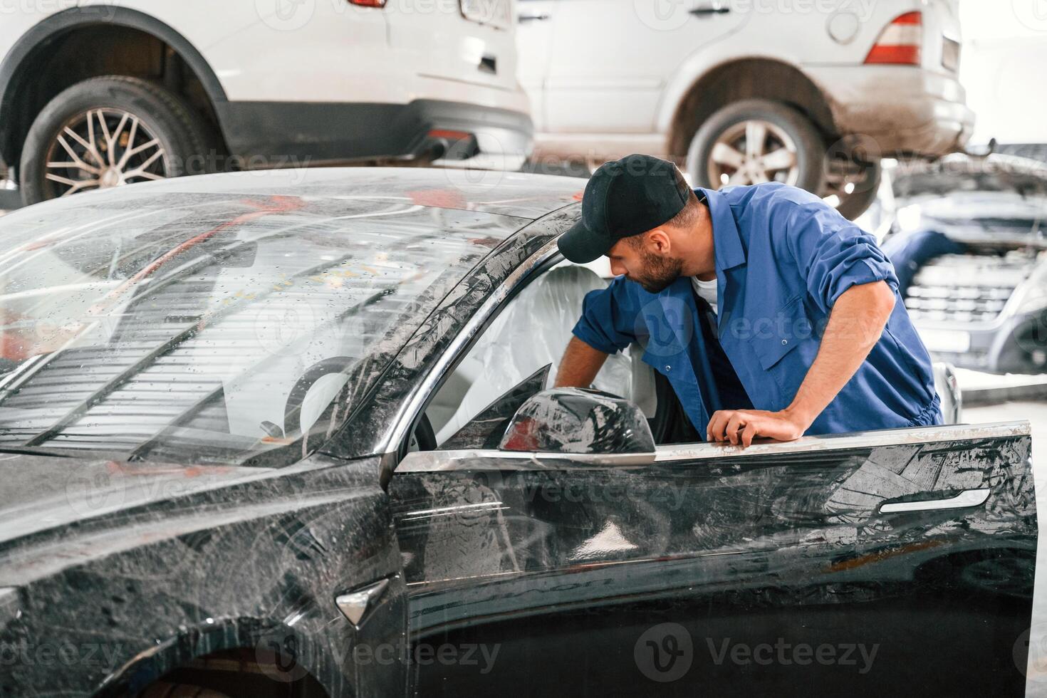 Dirty,, car is moved by auto mechanic that is in garage. Repair service photo