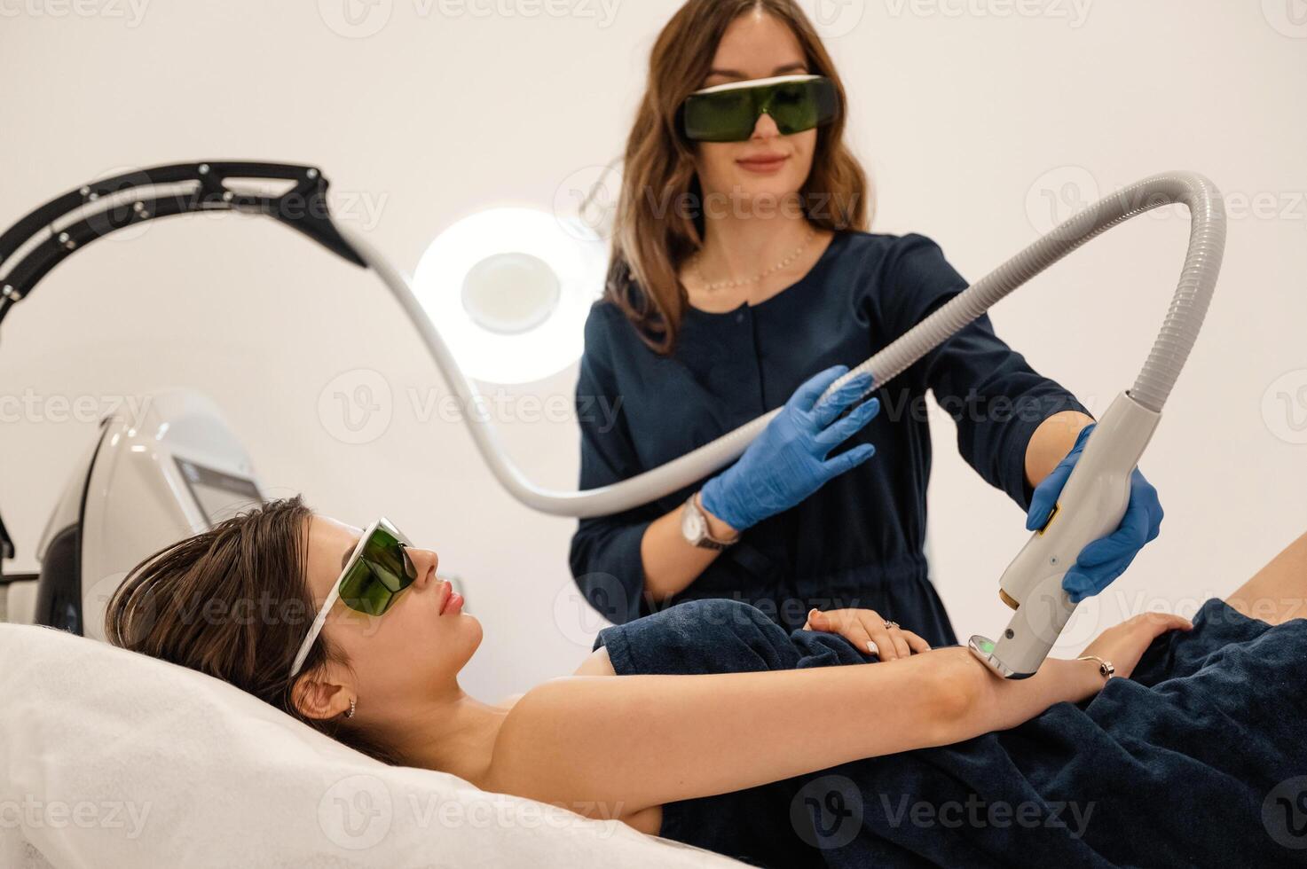 Procedure ,on, the hands. Getting photo rejuvenation at cosmetology clinic. Women in beauty salon