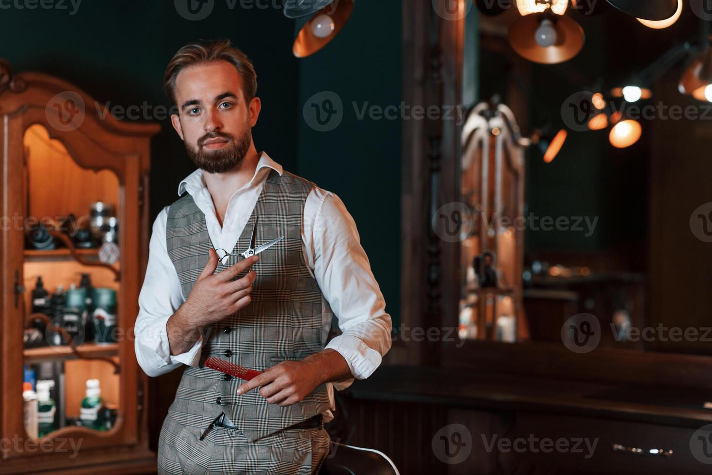 Handsome barber is in the salon., photo