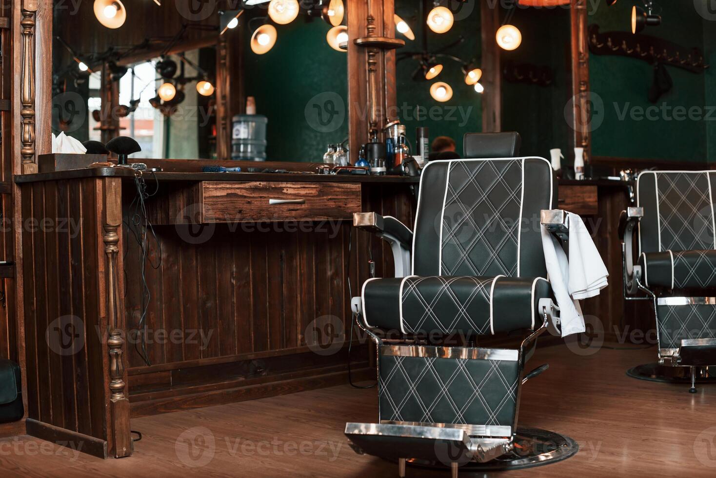 Inside of the barber shop. Chair, mirror, equipment photo