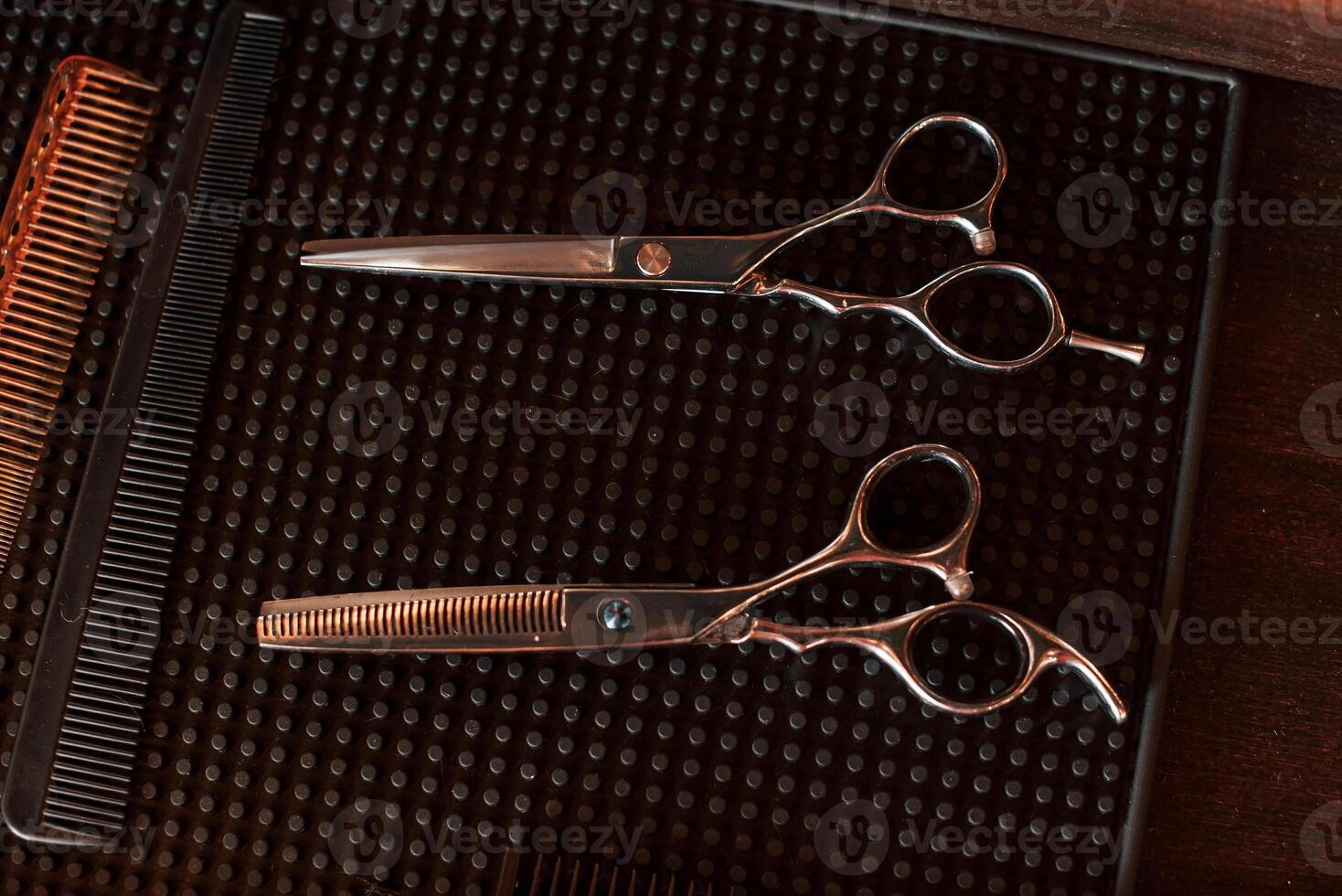 Top close up view of barber scissors that are lying down photo