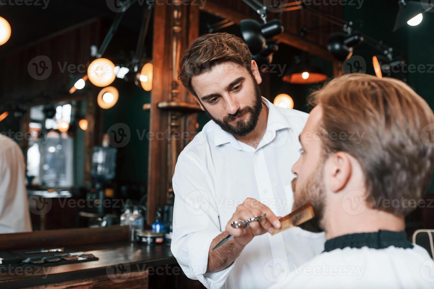 Man is ,visiting modern barber shop. Modern style photo
