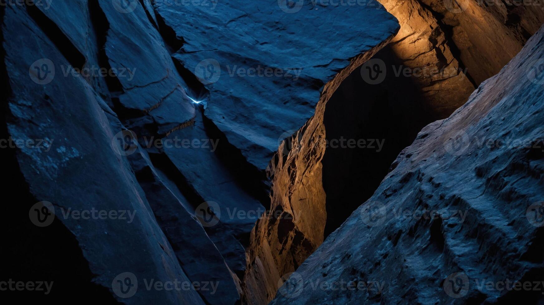 A dramatic canyon scene showcasing deep rock formations and contrasting light. photo