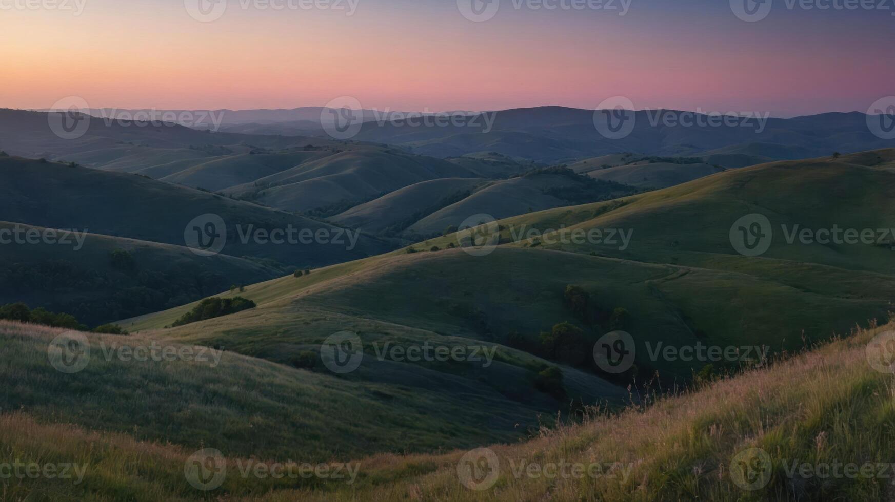 Serene landscape with rolling hills and a colorful sunset sky. photo