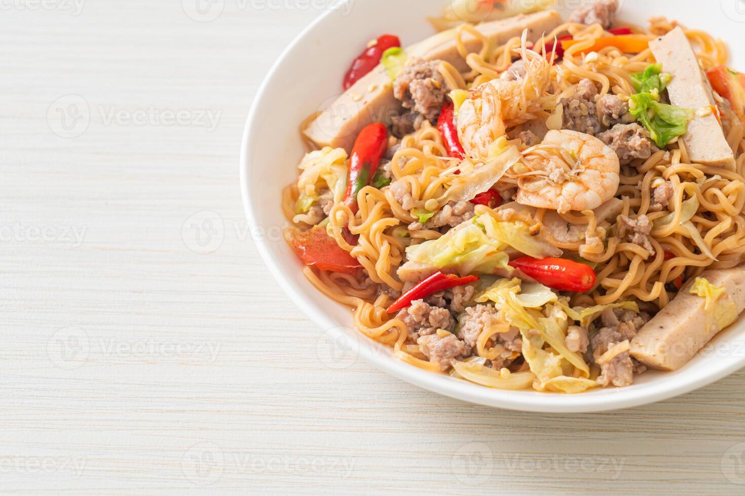 Instant noodles spicy salad on plate. photo