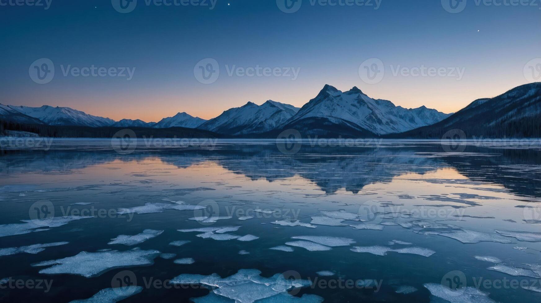 Icy Lake Reflecting Snowy Mountains at Twilight Scenery for Winter photo