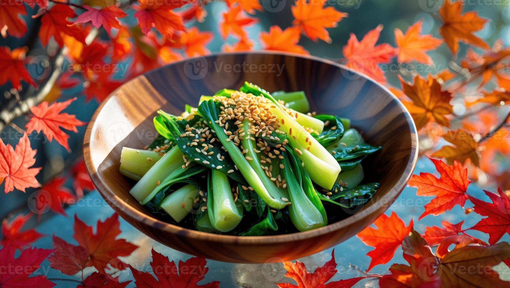 Bok Choy in Wooden Bowl Topped with Sesame Seeds and Autumn Leaves photo