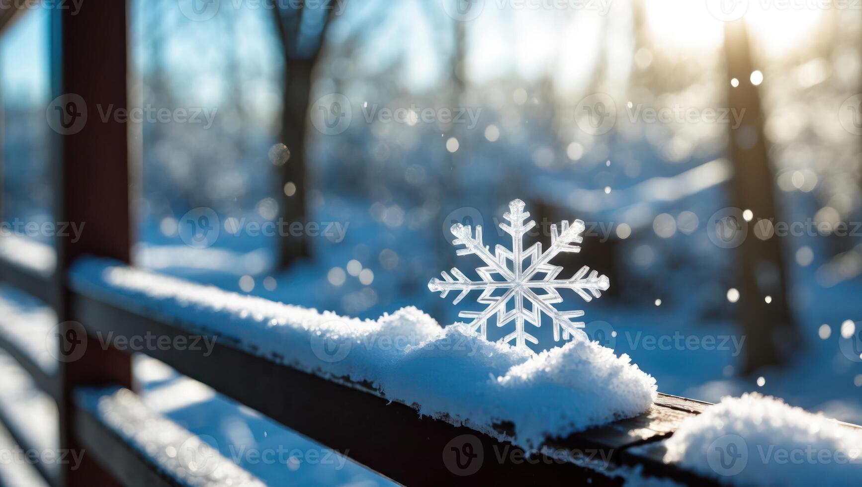 Snowflake on Snowy Railing in Winter Sunlight with Bokeh Effect photo