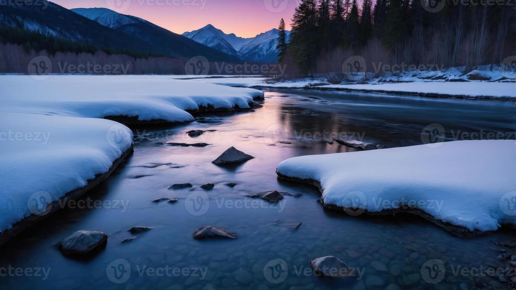 River Flowing Through Winter Landscape with Snow Covered Banks at Dusk photo