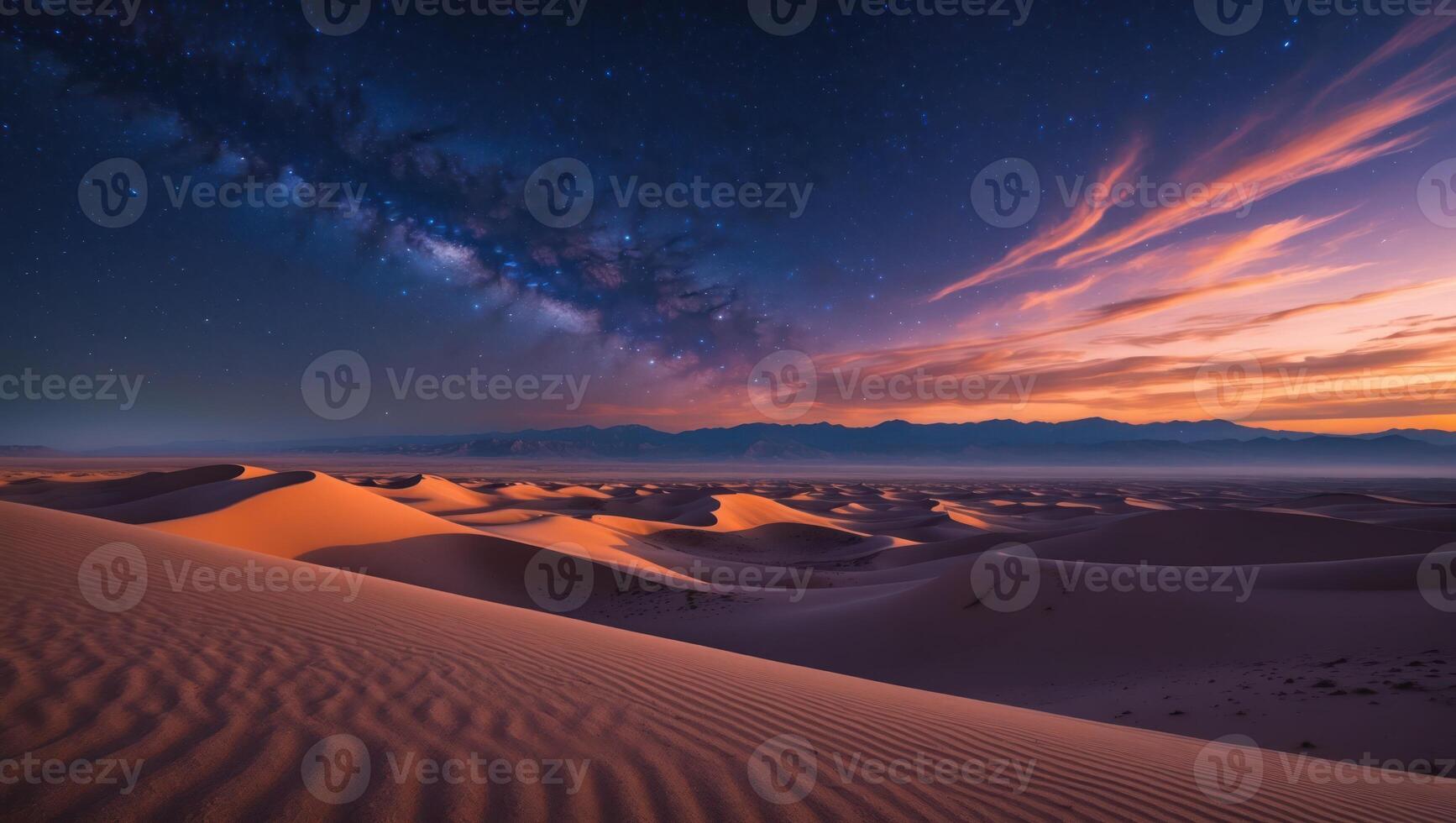 Desert Dunes Under Starry Sky at Twilight with Mountain Silhouette photo