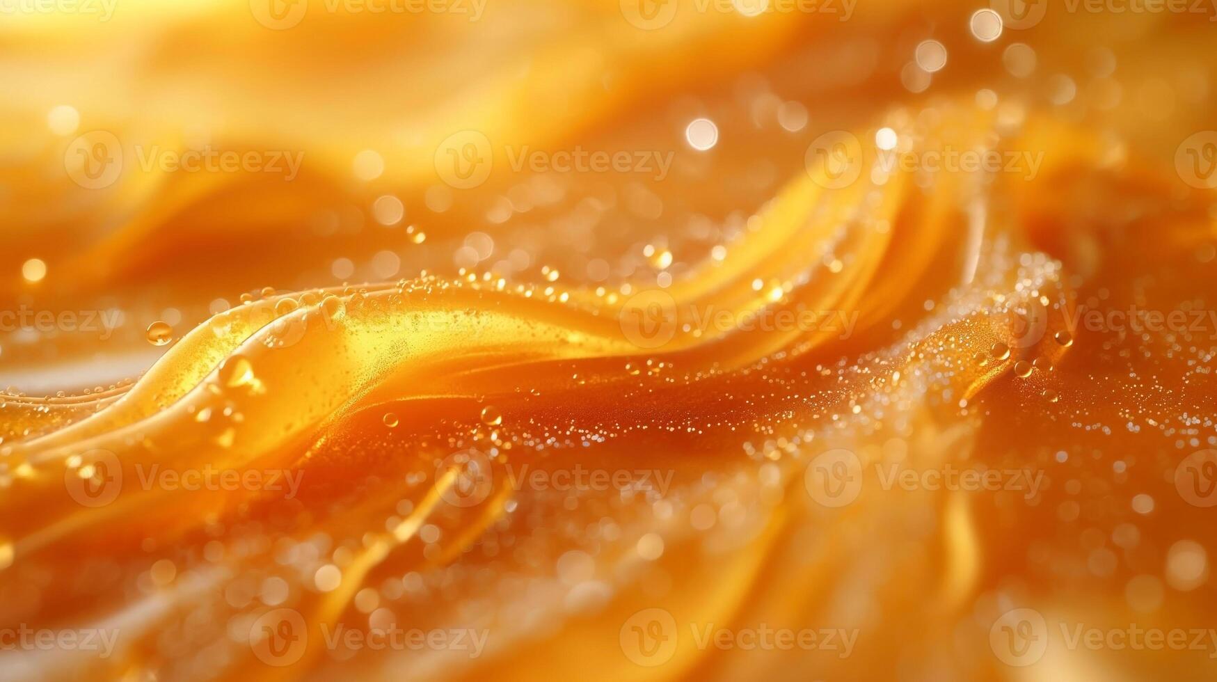 A close-up view of shimmering orange waves with sparkling droplets, creating an abstract and vibrant texture. photo