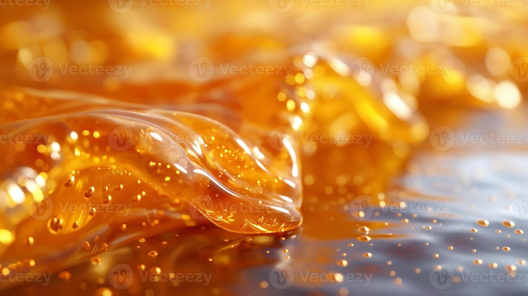 Close-up of golden amber gel with bubbles, creating a vibrant and fluid texture. photo
