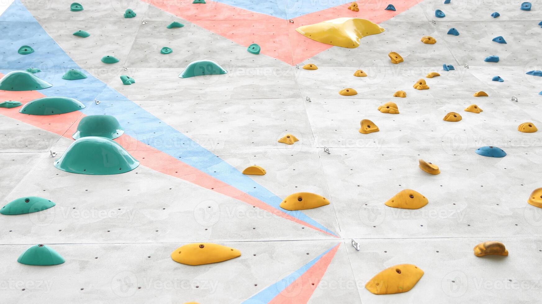 The climbing holds can be rearranged to create new and challenging routes photo