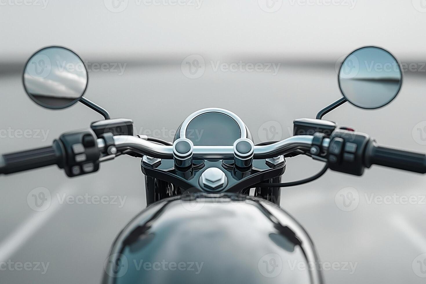 Close-up of a motorcycle handlebar with a foggy road ahead, inviting adventure and freedom. photo