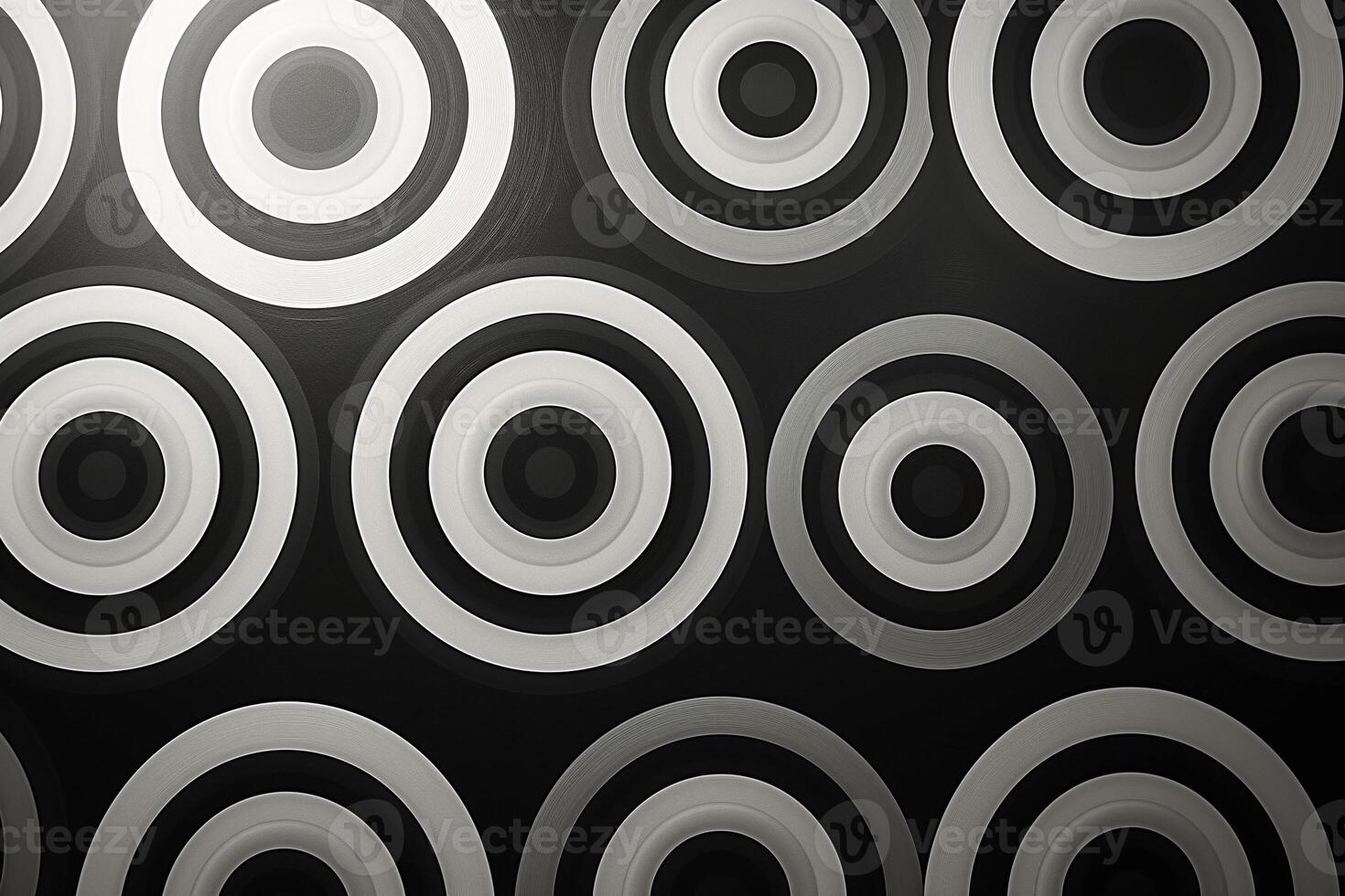 Abstract pattern featuring concentric circles in black, white, and gray tones. photo