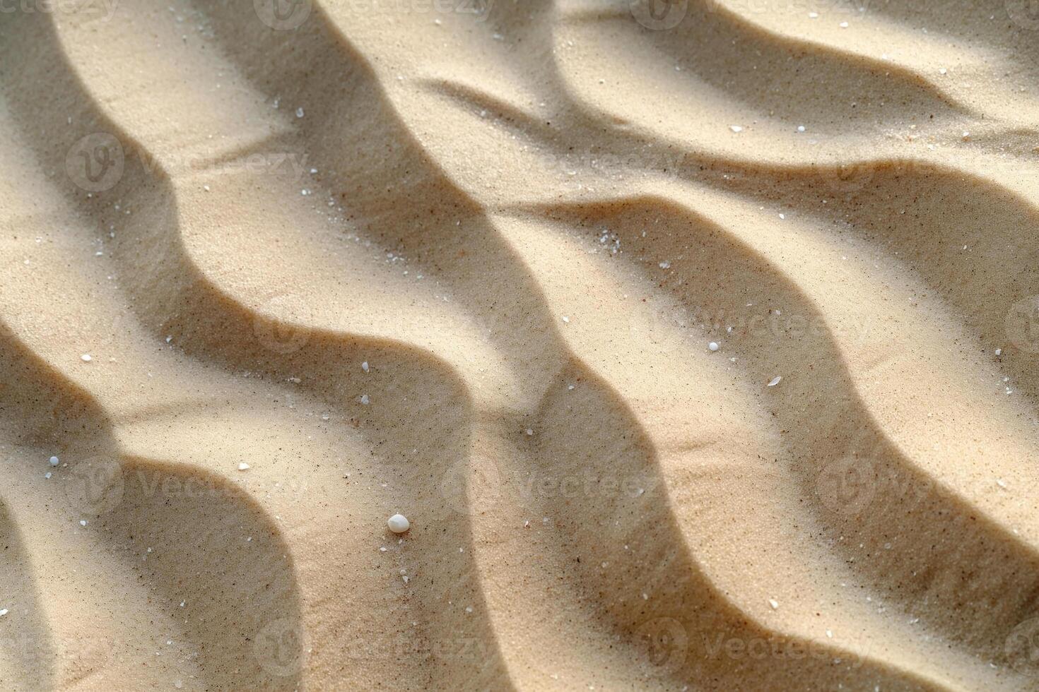 Close-up of smooth, undulating sand patterns illuminated by soft sunlight, creating a tranquil and serene atmosphere. photo