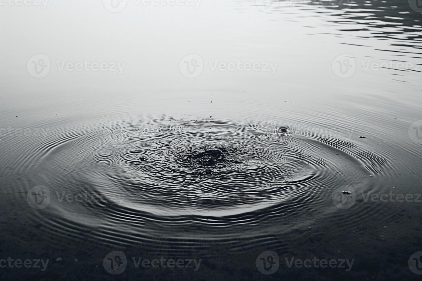 A serene close-up of ripples forming in the water, creating a calming effect. photo